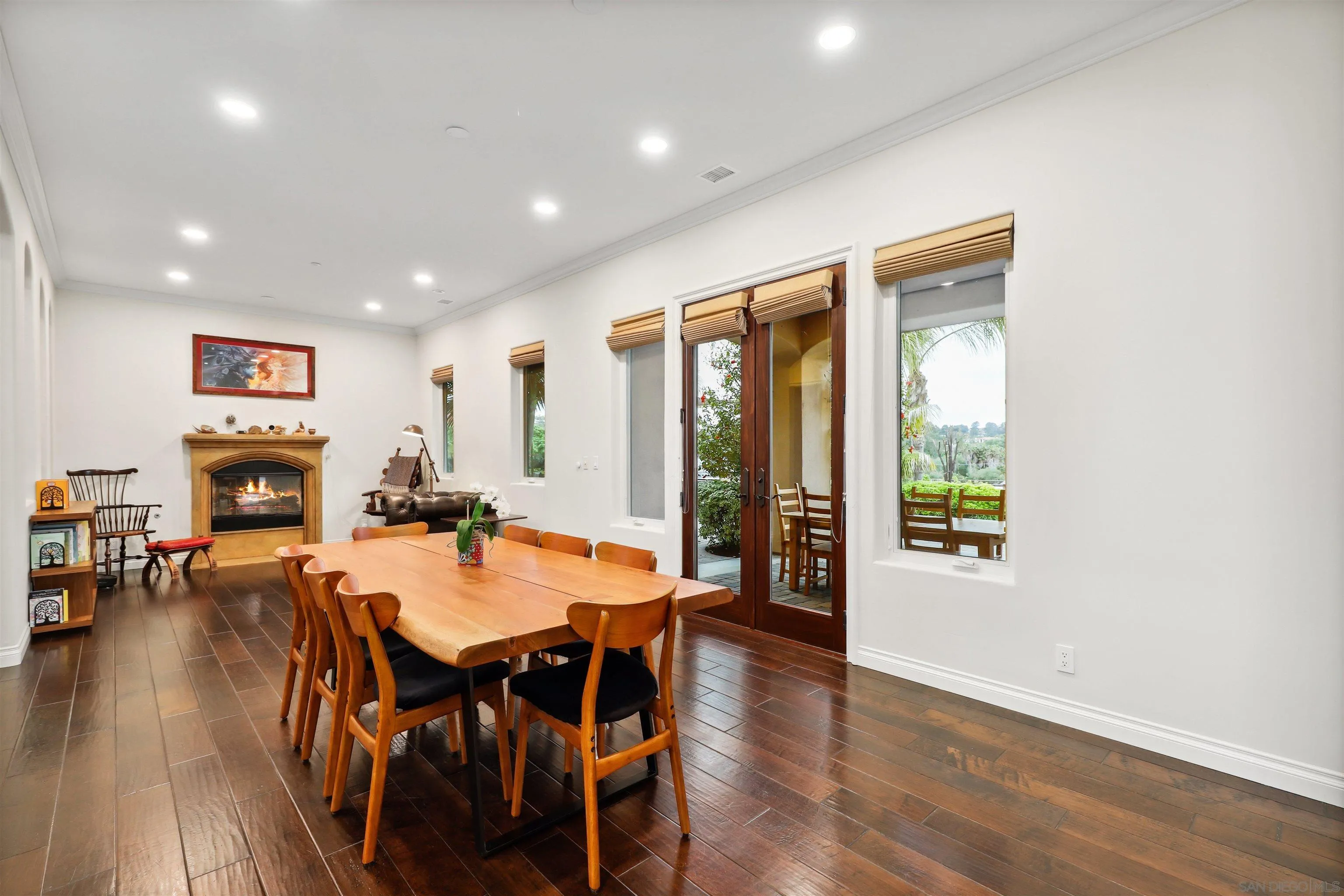 3055 Brookside Lane Encinitas, CA 92024 - Photo 11 of 64 a view of a dining room with furniture window and wooden floor