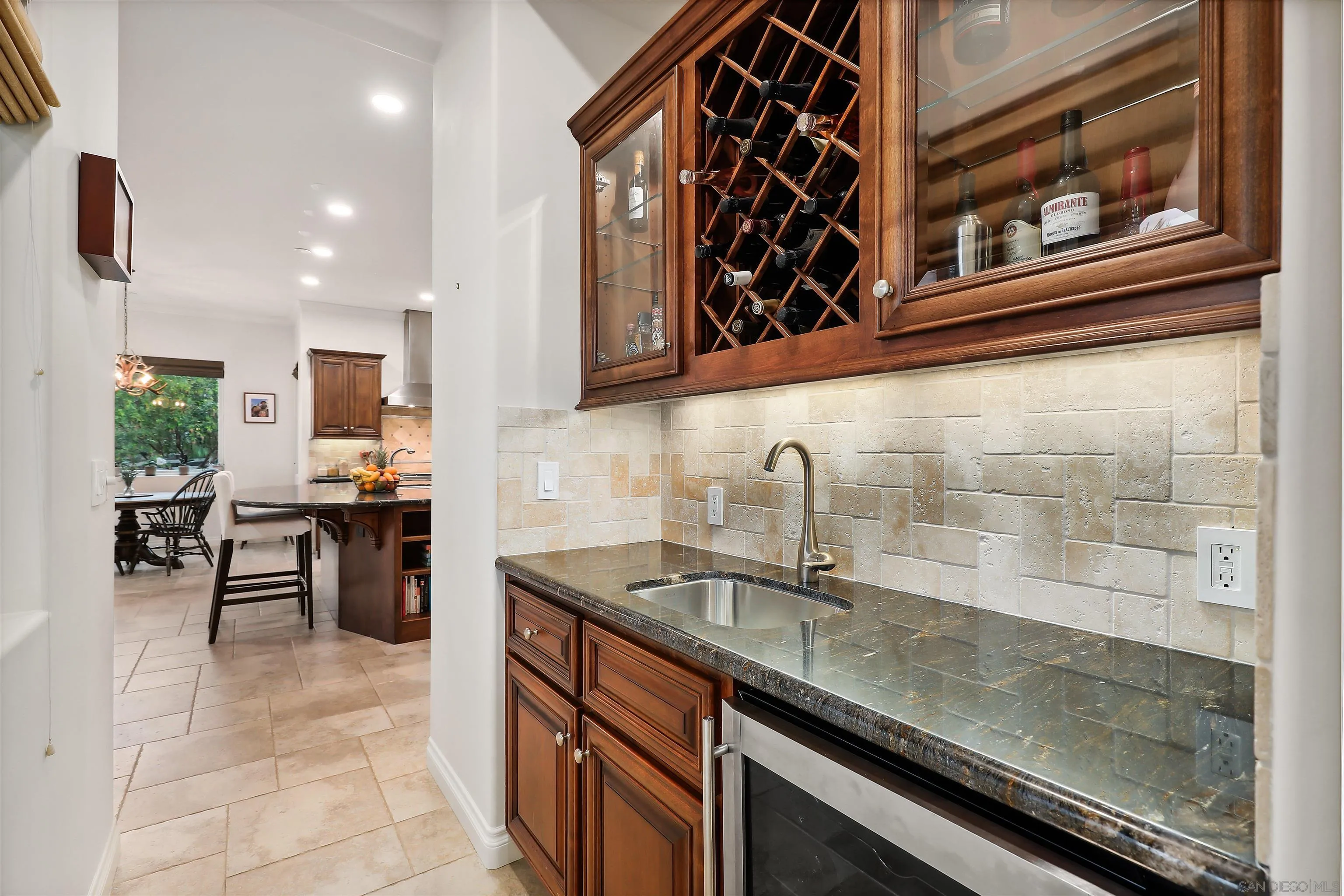 3055 Brookside Lane Encinitas, CA 92024 - Photo 13 of 64 a kitchen with stainless steel appliances granite countertop a sink stove and cabinets
