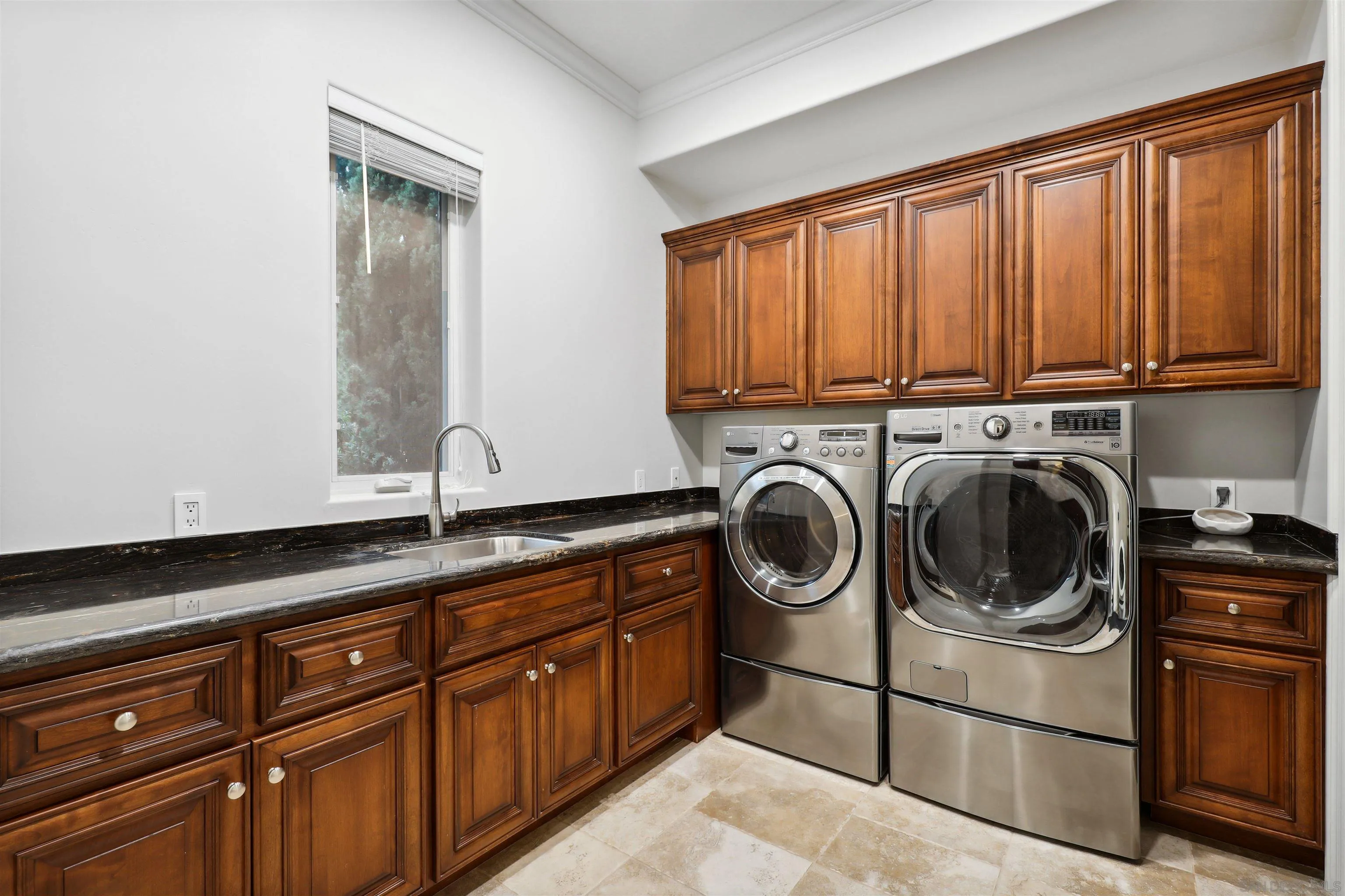 3055 Brookside Lane Encinitas, CA 92024 - Photo 42 of 64 a utility room with sink dryer and washer