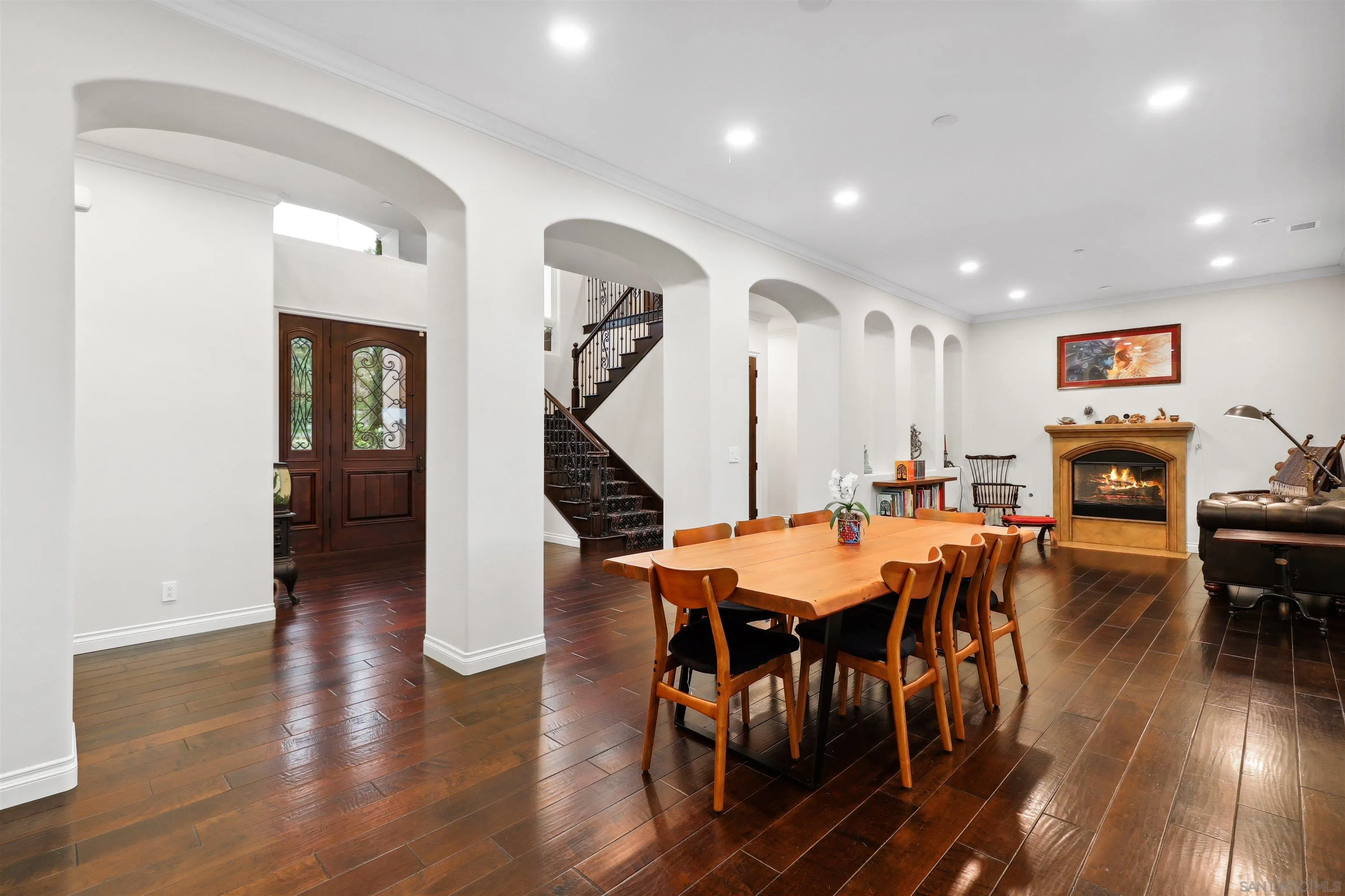 3055 Brookside Lane Encinitas, CA 92024 - Photo 10 of 64 a view of a dining room with furniture and wooden floor