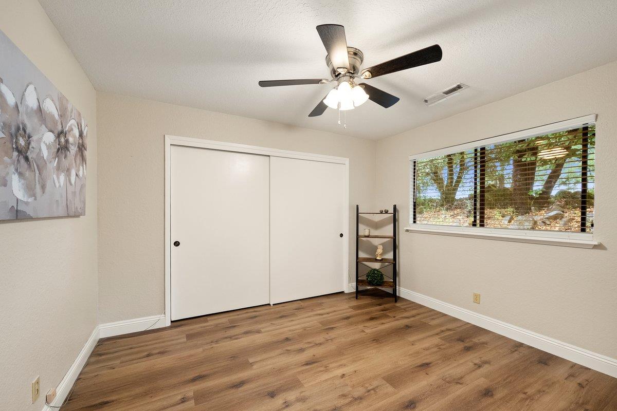 6561 Trinity Way Placerville, CA 95667 - Photo 23 of 58 a view of empty room with wooden floor and fan