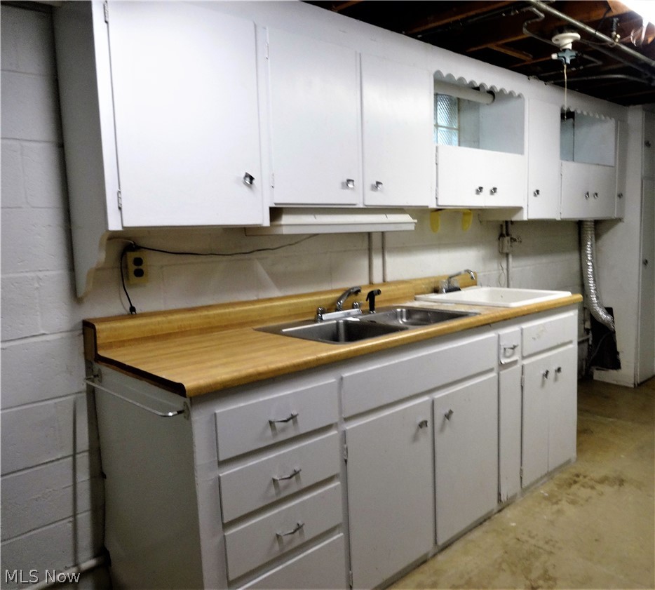 3940 West Sprague Road Parma, OH 44134 - Photo 21 of 34 This area was used as summer kitchen, has gas hook up for stove- was currently being used as laundry area
