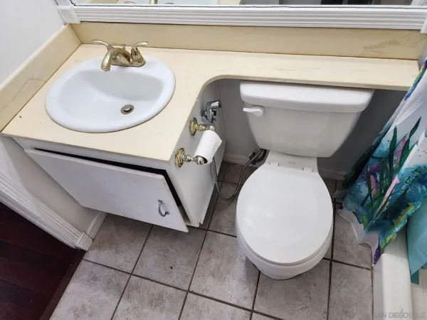 a bathroom with a toilet and a sink