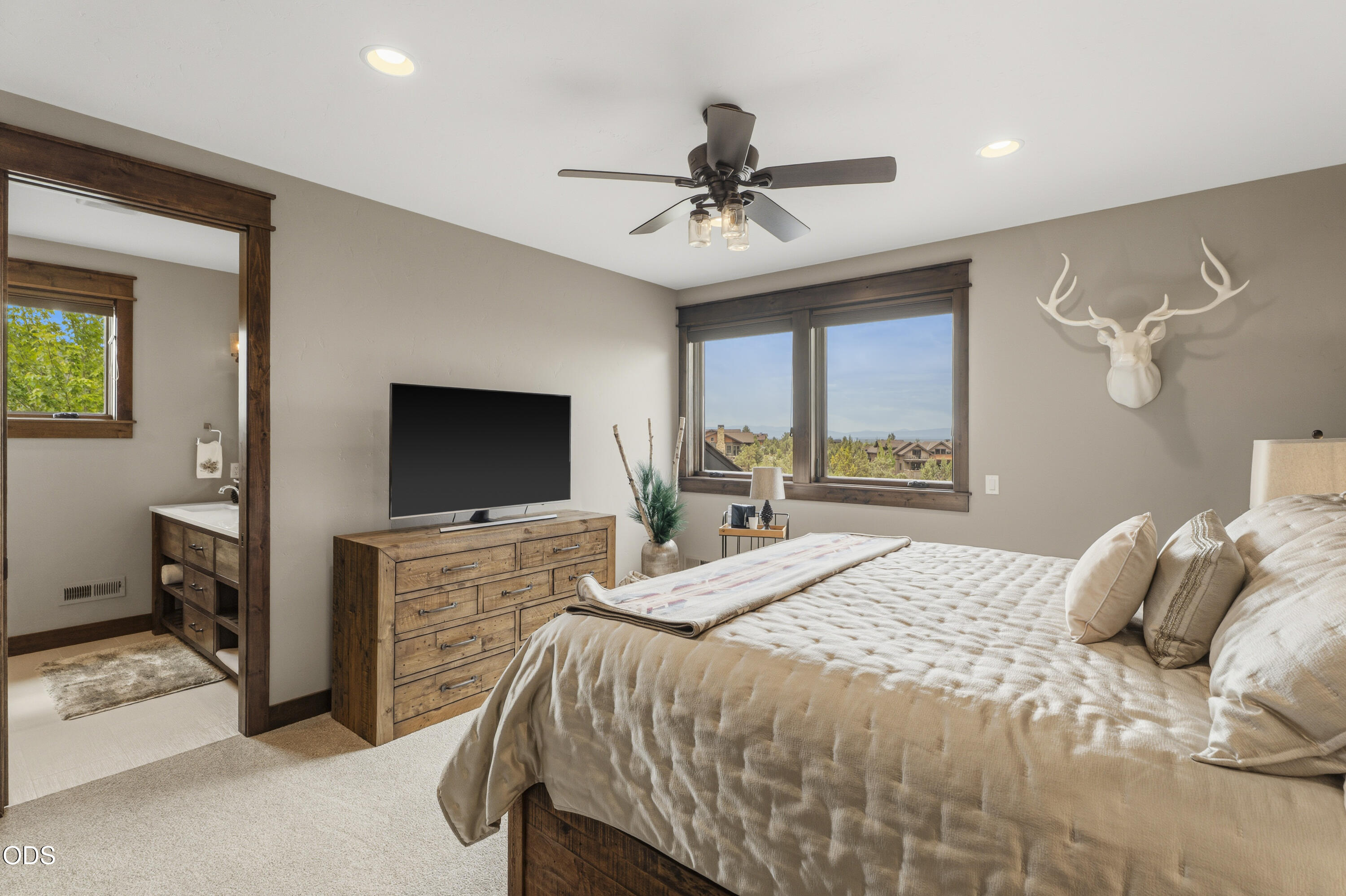15935 South W Brasada Ranch Road Powell Butte, OR 97753 - Photo 27 of 45 a bedroom with a bed and a flat screen tv