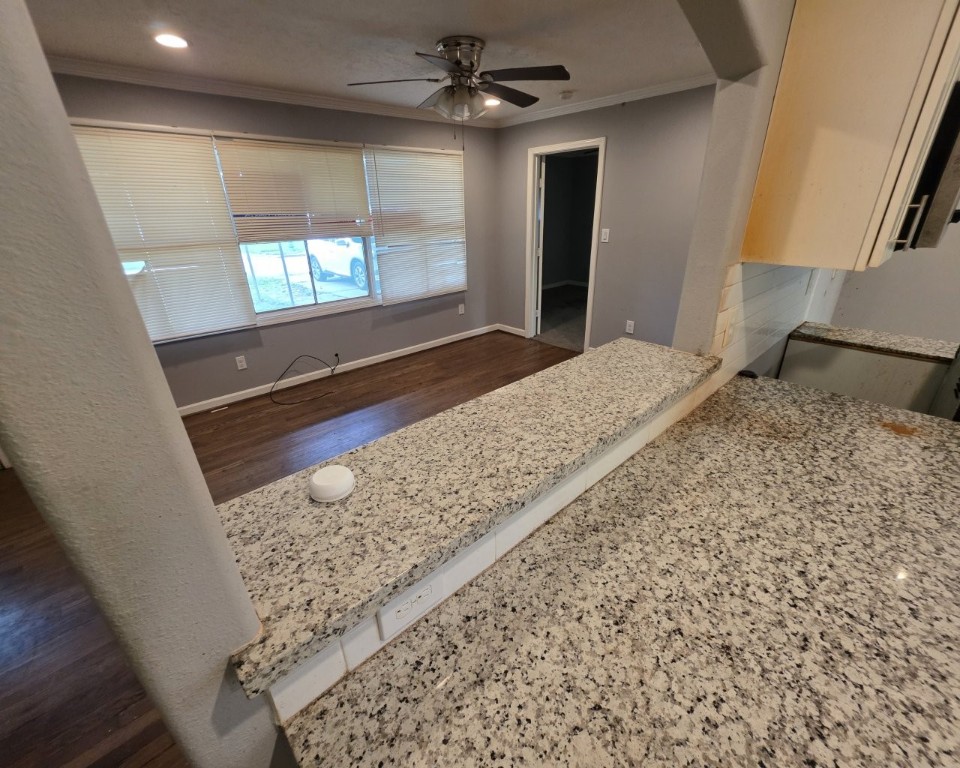 5503 Rue Street Houston, TX 77033 - Photo 5 of 15 Keep in touch with those in the living room from the kitchen