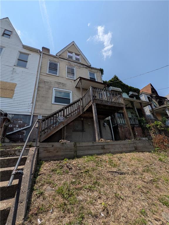 709-711 Fruit Way McKees Rocks, PA 15136 - Photo 25 of 37 a view of a house with a wooden fence