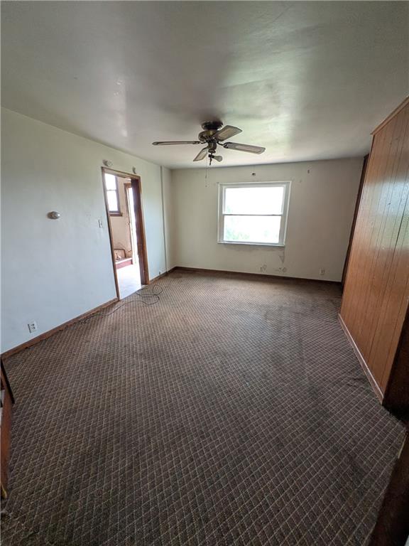 709-711 Fruit Way McKees Rocks, PA 15136 - Photo 28 of 37 en empty room with windows and ceiling fan