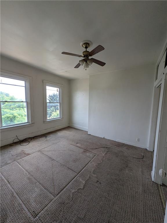709-711 Fruit Way McKees Rocks, PA 15136 - Photo 29 of 37 an empty room with windows and fan