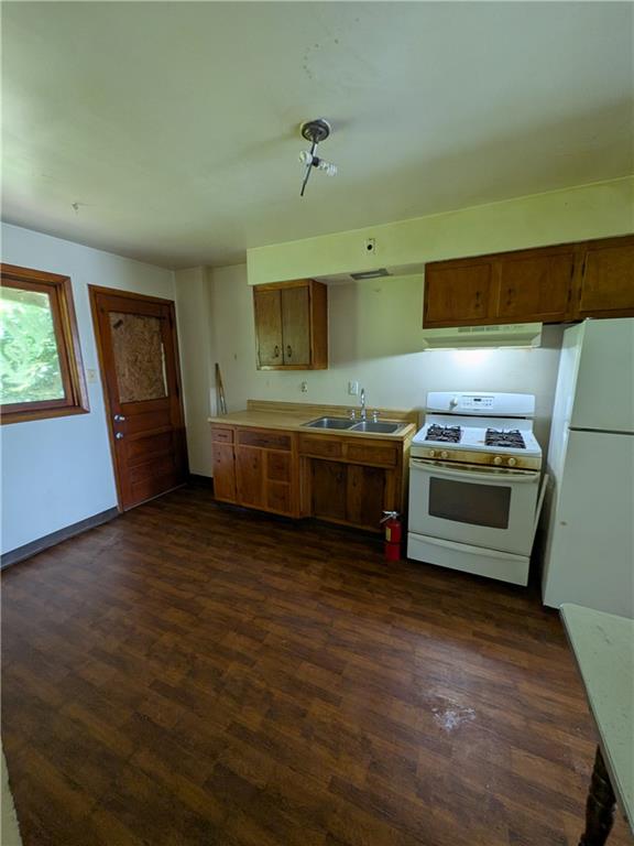 709-711 Fruit Way McKees Rocks, PA 15136 - Photo 30 of 37 a kitchen with stainless steel appliances wooden cabinets and a stove top oven