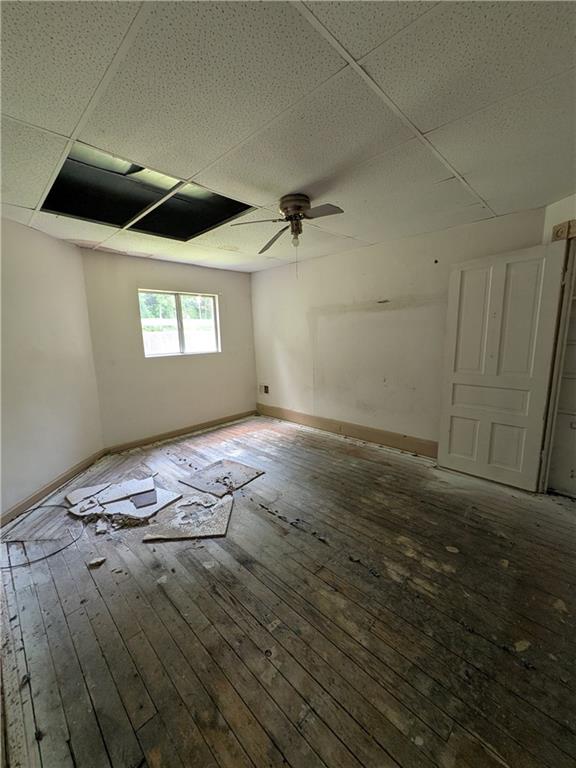 709-711 Fruit Way McKees Rocks, PA 15136 - Photo 3 of 37 an empty room with wooden floor and windows
