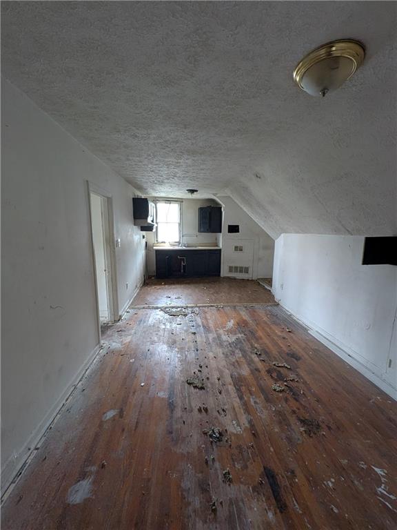 709-711 Fruit Way McKees Rocks, PA 15136 - Photo 10 of 37 a big room with wooden floor and windows