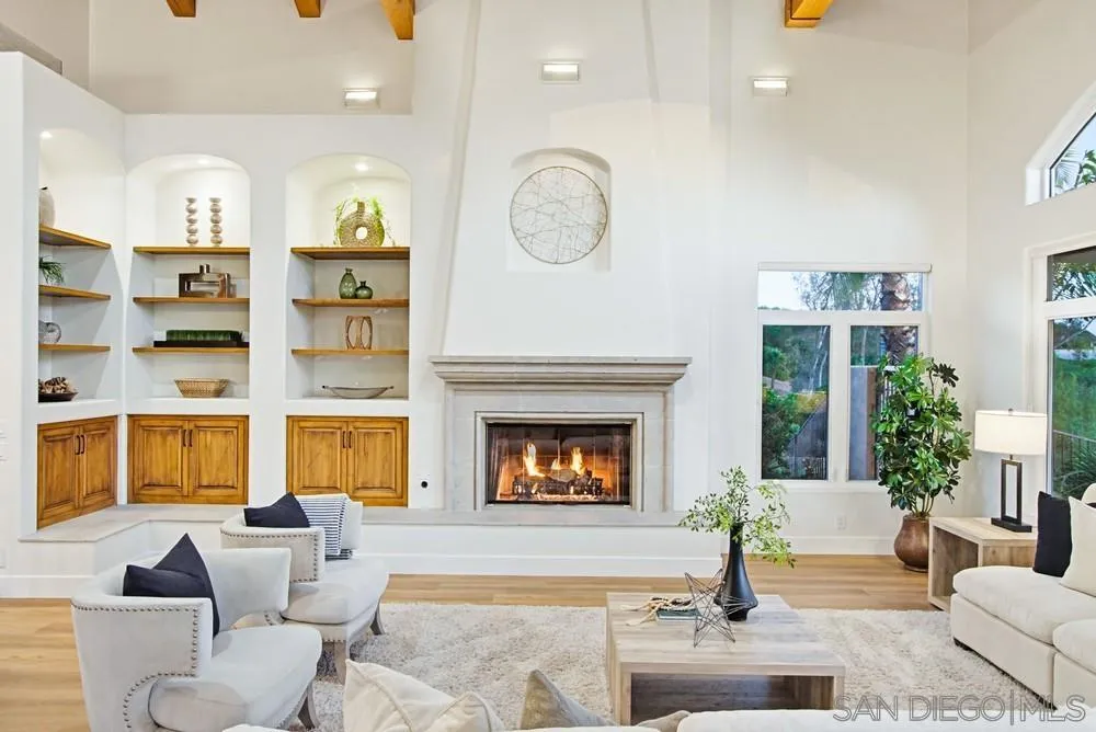 3993 Peony Drive Fallbrook, CA 92028 - Photo 15 of 52 a living room with furniture a fireplace and a large window