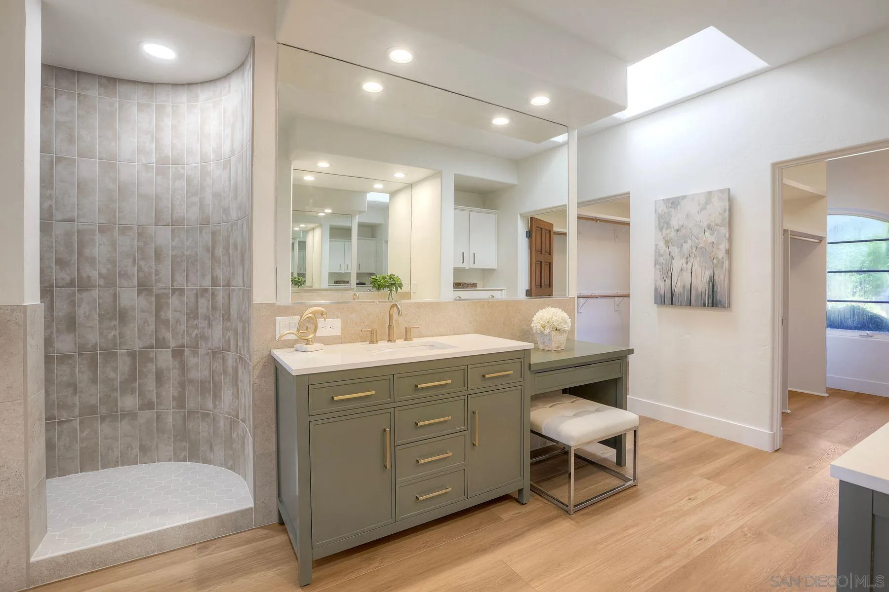 3993 Peony Drive Fallbrook, CA 92028 - Photo 21 of 52 a bathroom with a granite countertop sink a toilet a mirror and shower