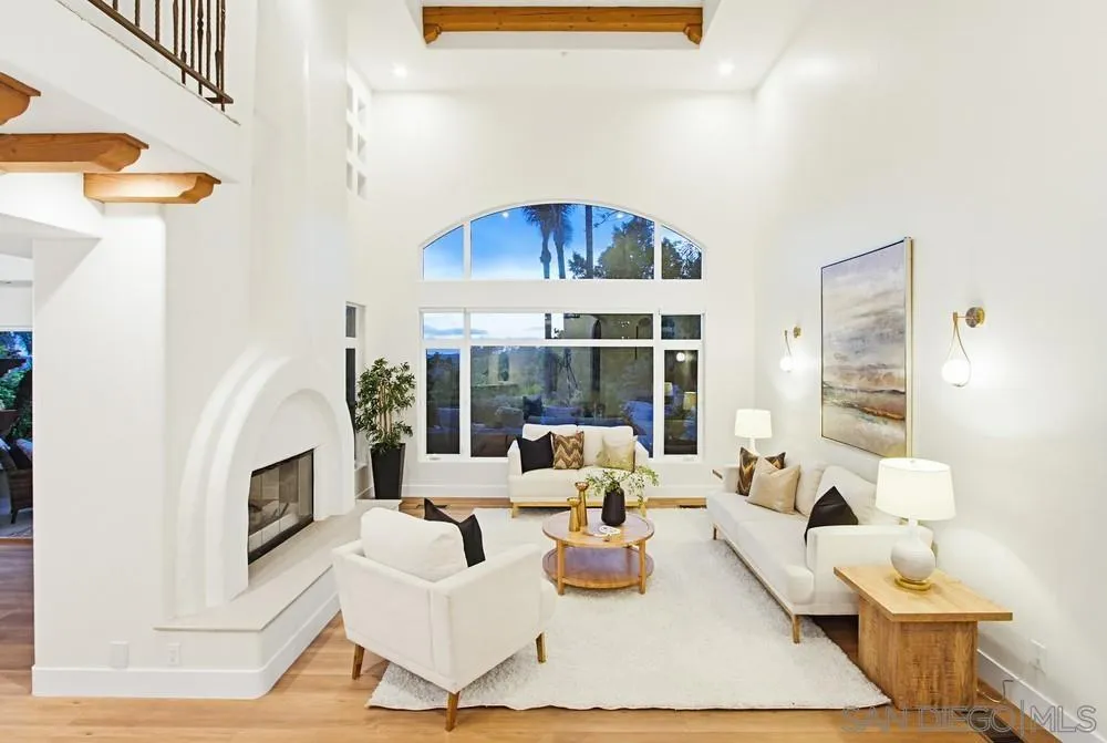 3993 Peony Drive Fallbrook, CA 92028 - Photo 7 of 52 a living room with furniture a fireplace and a floor to ceiling window