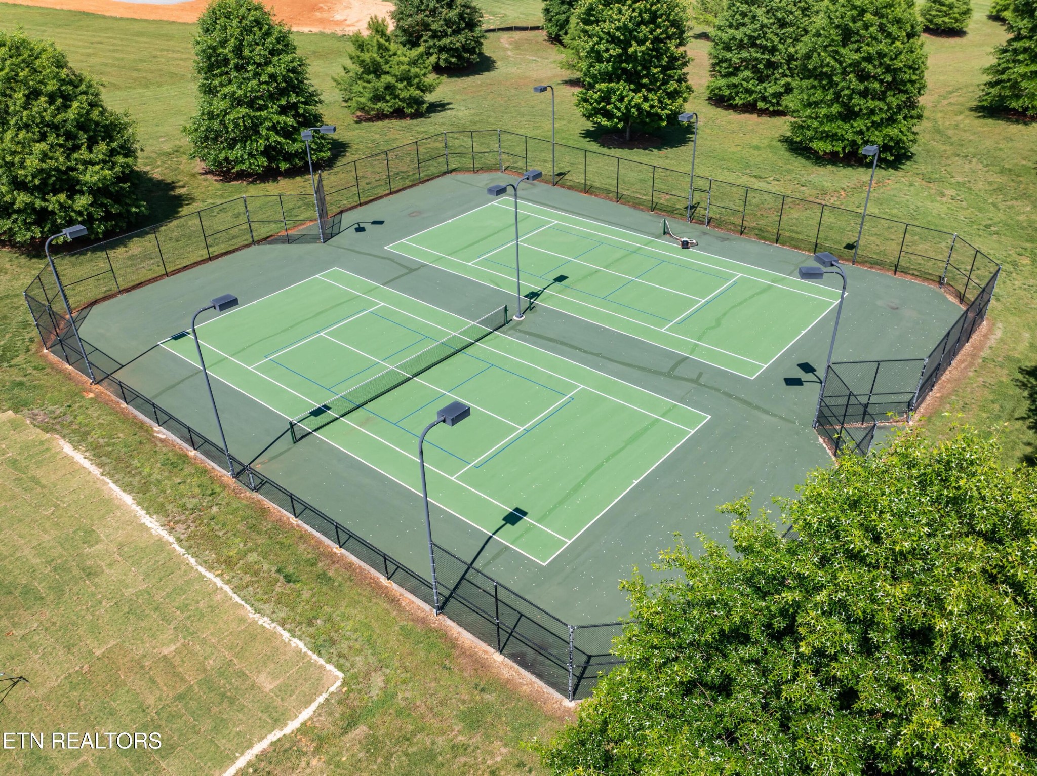 36 Thunder Ridge Drive Vonore, TN 37885 - Photo 17 of 30 a tennis court with view of trees in the background