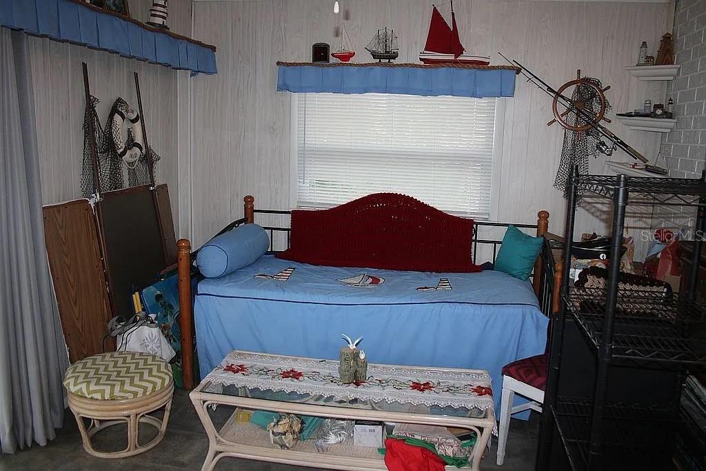 4252 Bardot Road Port Charlotte, FL 33953 - Photo 11 of 17 a living room with furniture and wooden floor