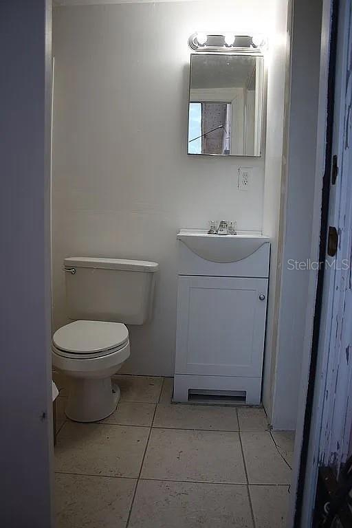 4252 Bardot Road Port Charlotte, FL 33953 - Photo 13 of 17 a bathroom with a toilet a sink and mirror