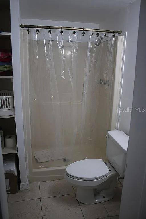 4252 Bardot Road Port Charlotte, FL 33953 - Photo 15 of 17 a bathroom with a toilet and shower