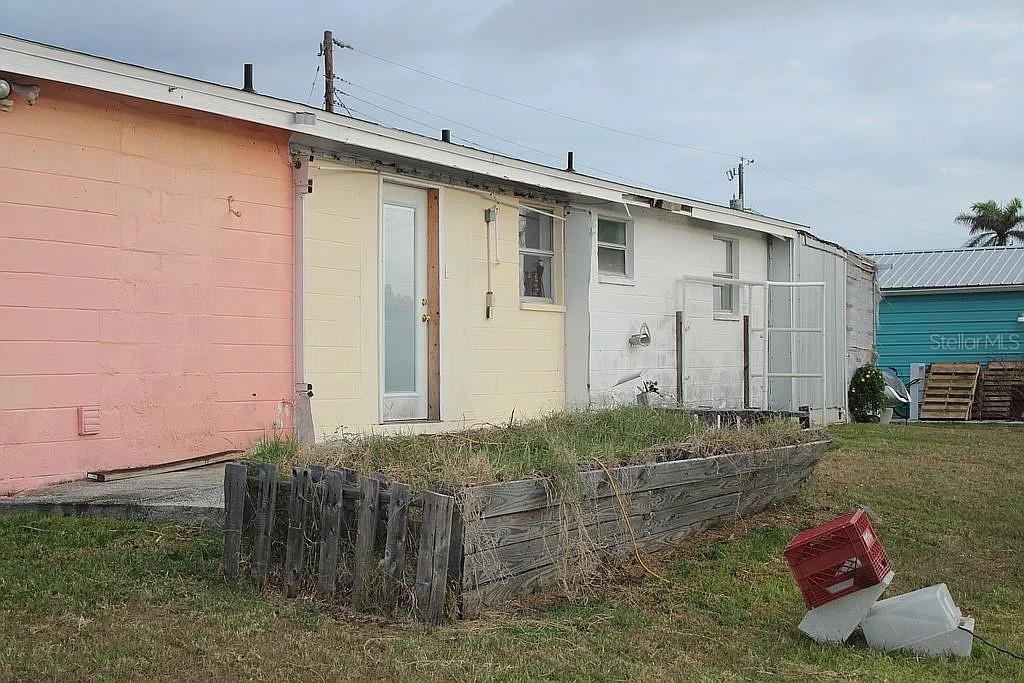 4252 Bardot Road Port Charlotte, FL 33953 - Photo 16 of 17 a backyard of a house