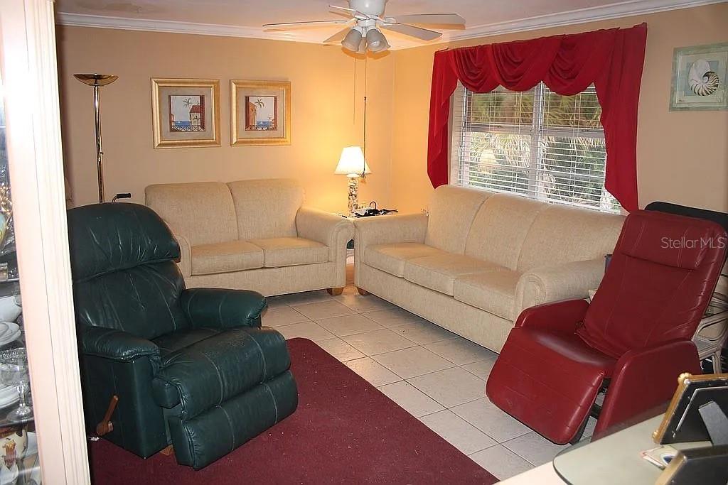 4252 Bardot Road Port Charlotte, FL 33953 - Photo 7 of 17 a living room with furniture and a window