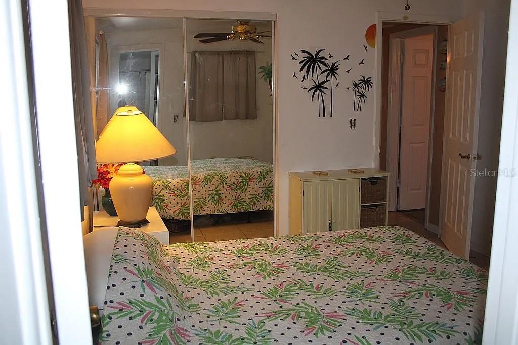 4252 Bardot Road Port Charlotte, FL 33953 - Photo 10 of 17 a bedroom with a bed and teddy bear on table