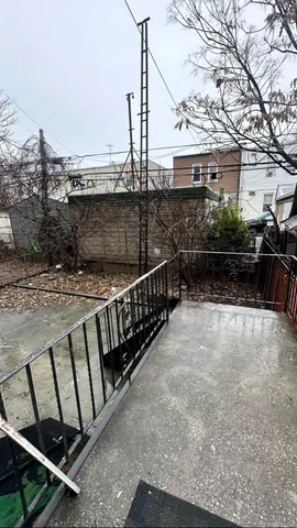 a view of a terrace with wooden fence