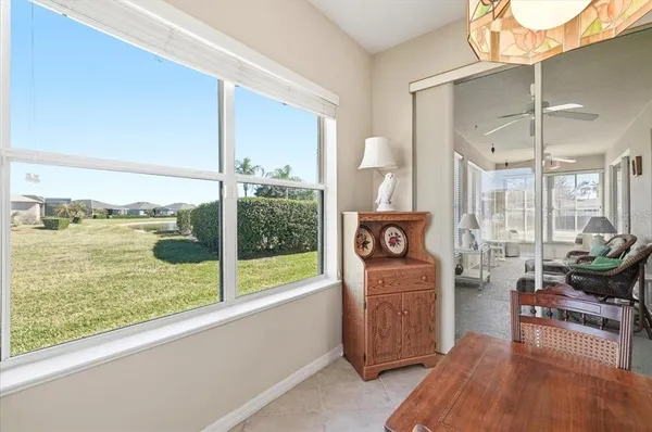 a view of a dining room with furniture window and chandelier