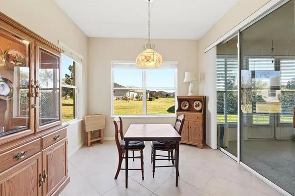 a dining room with furniture and window