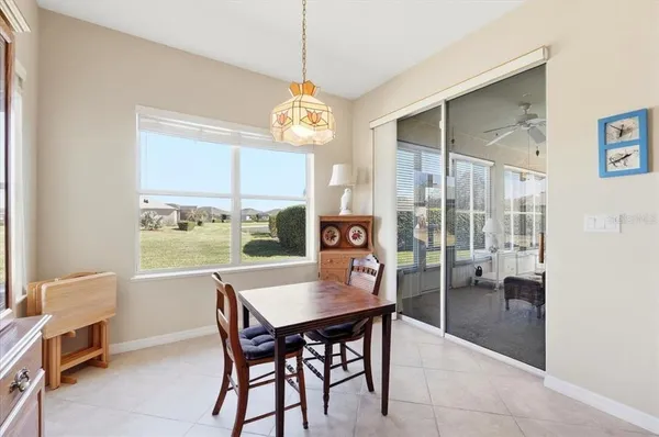 a bed room with a bed and a chandelier