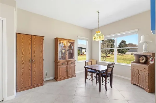 a spacious bedroom with a bed and a window