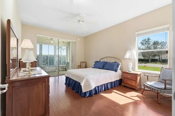 a spacious bathroom with a toilet sink and mirror
