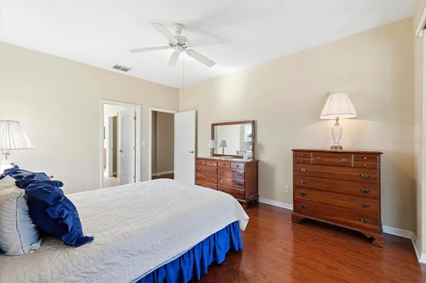 a bathroom with a double vanity sink a mirror and shower