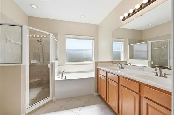 a bedroom with a bed and a table