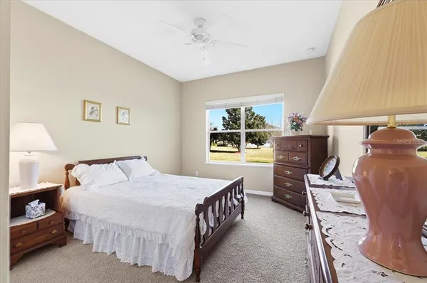 a view of a workspace with furniture and wooden floor