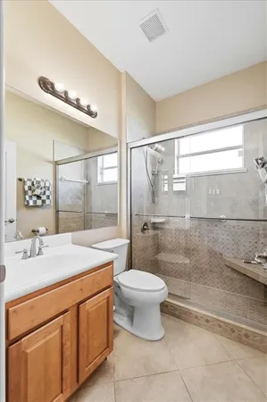 a view of a livingroom with workspace and a window