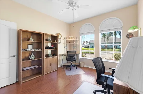 a view of a garden with a building in the background
