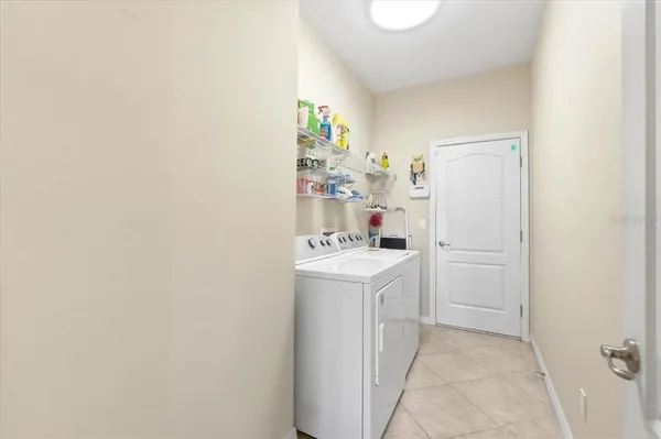 a view of a swimming pool with an outdoor seating