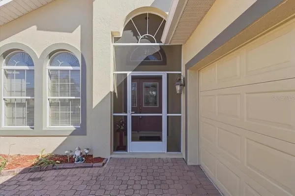 a view of a dining room with furniture and window