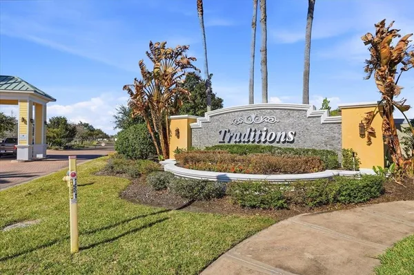 a workspace with furniture and a large window