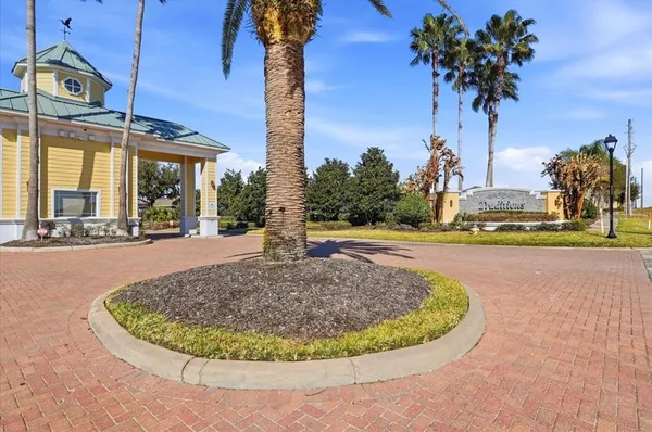 a room with furniture pool table and windows