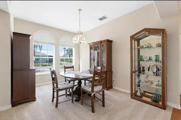 a large kitchen with a large counter top appliances and cabinets