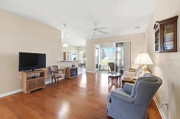 a kitchen with stainless steel appliances granite countertop a sink refrigerator and cabinets