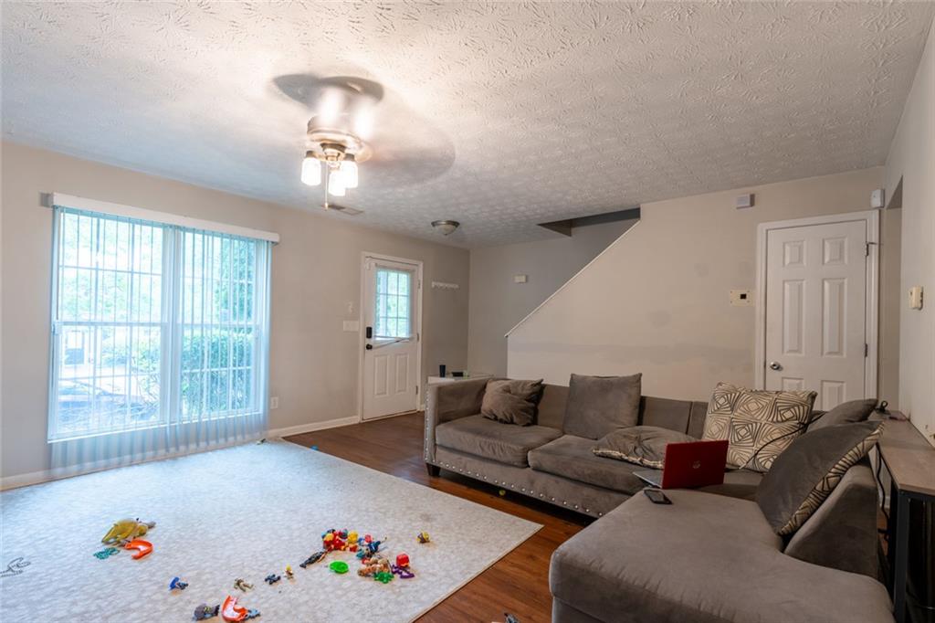 3474 Waldrop Trail Decatur, GA 30034 - Photo 2 of 17 a living room with furniture flowerpot and wooden floor