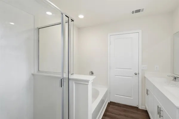 a bathroom with a shower and a sink