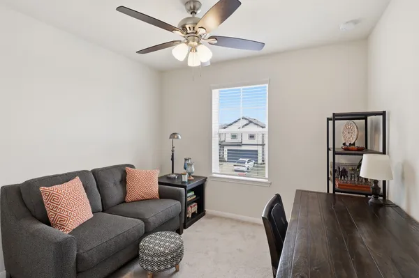 a living room with furniture and a window