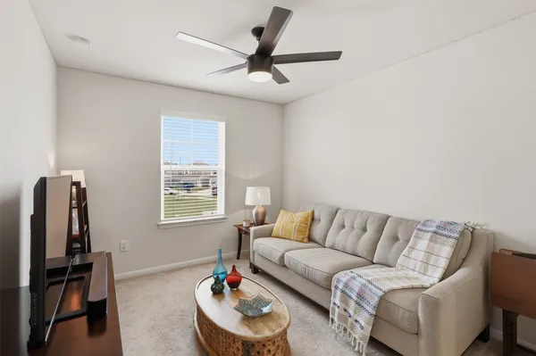 a living room with furniture and a window