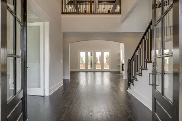 a view of an entryway with wooden floor