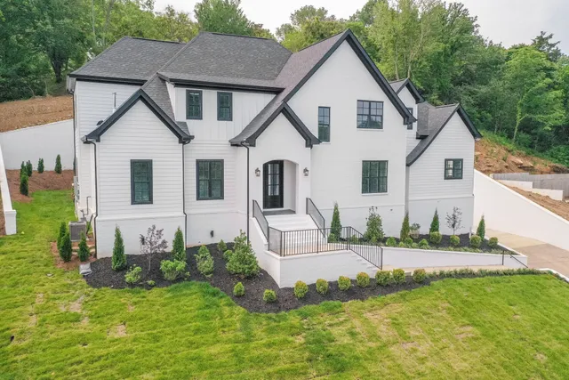 a front view of a house with a yard