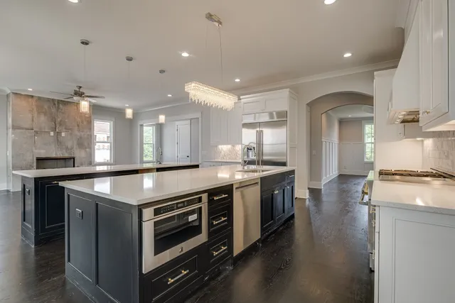 a kitchen with a stove and a sink