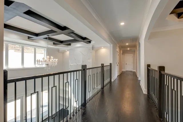 an empty room with a ceiling fan and a window